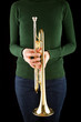 beautiful blonde girl holds a golden trumpet