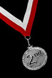 Silver medal with red and white ribbon