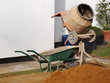 Photo: Wheelbarrow and mobile cement mixer Wheelbarrow and mobile cement mixer