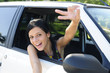 Photo: new car: teenage girl showing victory sign new car: teenage girl showing victory sign