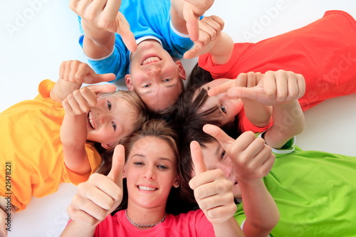 Photo: Kids giving a thumbs up Kids giving a thumbs up