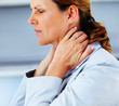 Neck pain - Young business woman suffering