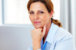 Cute young business woman sitting at office