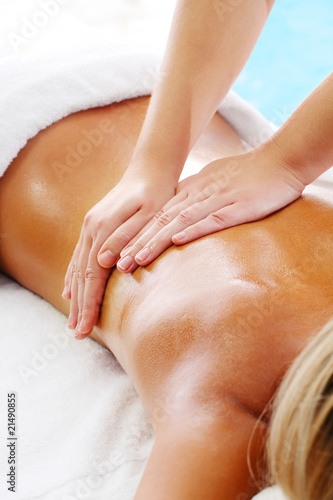 Photo: Massage Techniques I - woman receiving professional massage. Massage Techniques I - woman receiving professional massage.