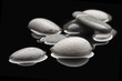 Stones isolated on black. Reflected.