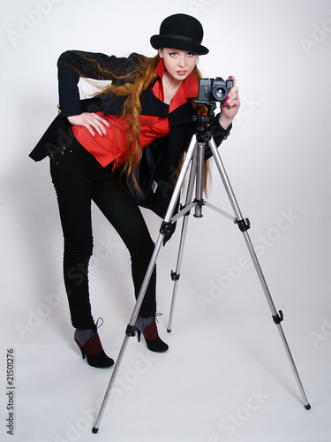 Foto: The beautiful girl removing on a camera The beautiful girl removing on a camera