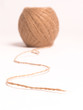 Clew of linen twine isolated on white background.