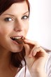 beautiful young woman with a bar of chocolate