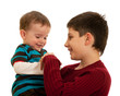 Two brothers are playing with their hands
