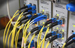 Photo: Optic cables connected to router ports Optic cables connected to router ports