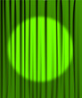 Green curtain with a spotlight