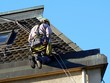 A man sat on a roof