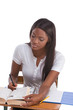 Photo: College student African American woman by desk College student African American woman by desk