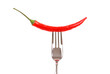 Red hot chili pepper pricked on the steel fork
