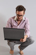 a young man with a laptop