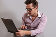 a young man with a laptop