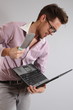 a young man with a laptop