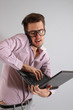 a young man with a phone and laptop