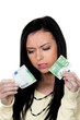 Woman with half a euro banknote. Steuern.Inflation.