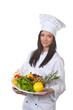 Cook served a bowl of fruit and vegetables