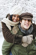Couple having fun outside in winter