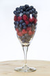 Photo: Glass Full of Blueberries and Raspberries Glass Full of Blueberries and Raspberries