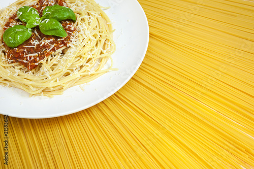 Photo: Plate of Spaghetti Bolognese on A Sunny Display of Dried Pasta Plate of Spaghetti Bolognese on A Sunny Display of Dried Pasta