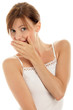 Young woman covering mouth