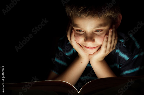 Photo: Boy reading bedtime story Boy reading bedtime story