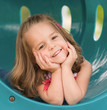 Photo: Girl Playing at the Playground Girl Playing at the Playground