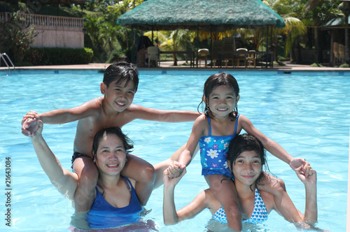 Photo: happy friends on a pool happy friends on a pool