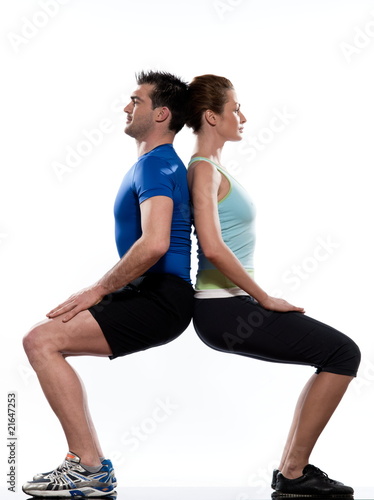 Photo: couple doing workout on white isolated background couple doing workout on white isolated background