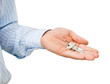 Keys in a man's hand on a white background