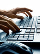 Hand typing on keyboard