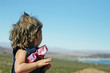 Child Overlooking a Scenic Lake View