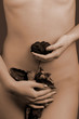 Woman holding a withered red rose in her hands Woman holding a withered red rose in her hands