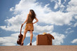 Pretty woman with suitcase and guitar Pretty woman with suitcase and guitar