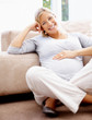 Foto: Happy mature pregnant woman smiling at home Happy mature pregnant woman smiling at home