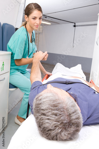 Photo: Nurse caring after a patient Nurse caring after a patient