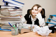 Young businesswoman with tons of documents