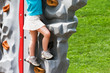 Young Girl on Rock Wall at the Park