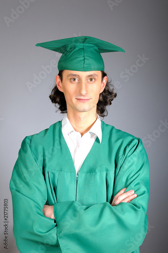 Photo: portrait of a succesful man on his graduation day in green portrait of a succesful man on his graduation day in green