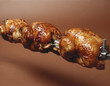 Grilled chickens on a spit