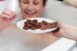 Cheerful young woman eating chocolate while having a bath Cheerful young woman eating chocolate while having a bath