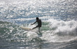 surfer rides a wave