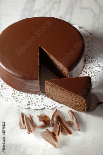 Photo: Sachertorte (Austrian chocolate cake) with a piece cut Sachertorte (Austrian chocolate cake) with a piece cut
