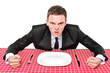 An angry man waiting his food in a restaurant