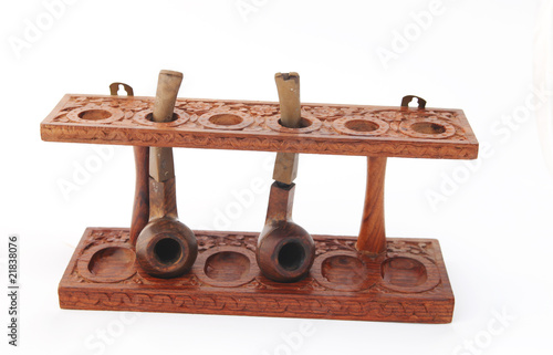 Photo: Old carved wooden pipe stand with pipes Old carved wooden pipe stand with pipes
