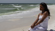 Woman In White Sitting At Beach