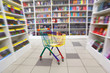 Bookshop interior. Before racks with books there is cart